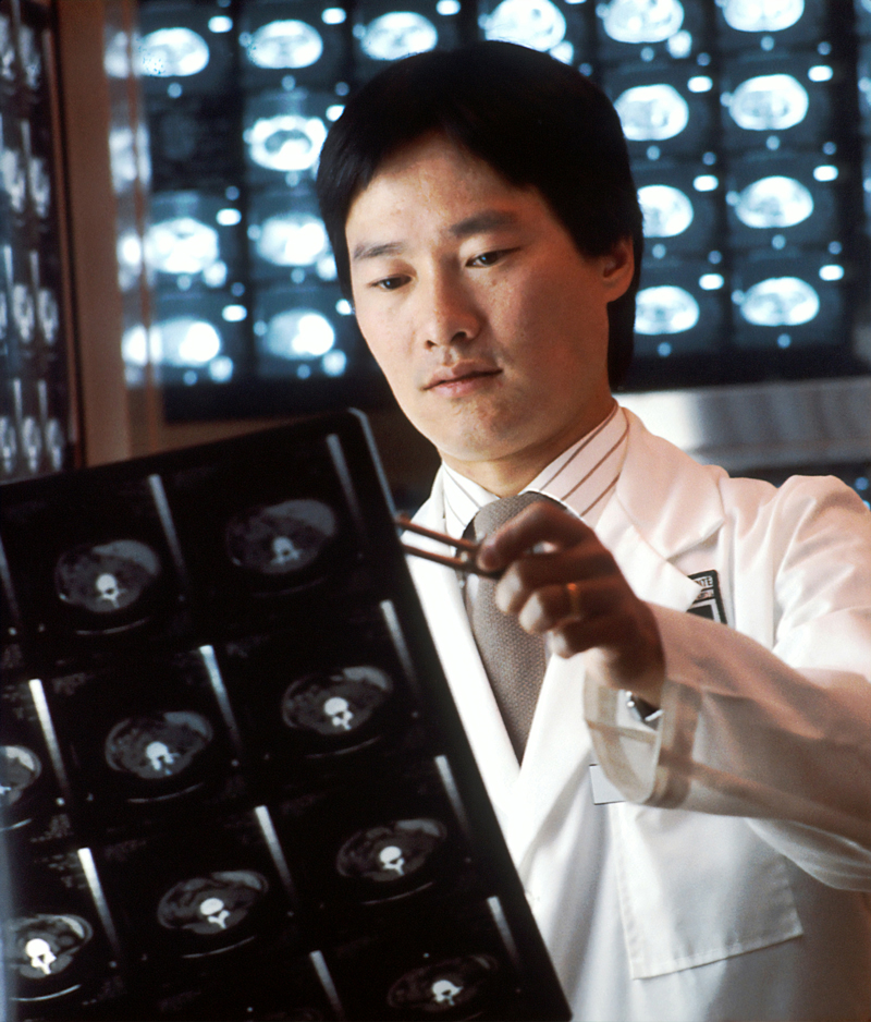 Radiologist reading x-rays